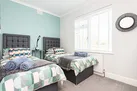The twin bedroom  on the ground floor with view over the front of Middlecombe, and a sea glimpse!