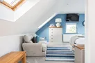 The master bedroom is large enough to use as a relaxing escape when you need time alone.