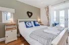 The first floor rear double bedroom with views over the Ley.
